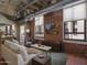 Inviting living room featuring exposed brick walls, high ceilings, and plenty of natural light at 114 W Adams St # 907, Phoenix, AZ 85003
