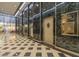 Lobby area with marble walls, package delivery doors, and vintage art deco details at 114 W Adams St # 907, Phoenix, AZ 85003