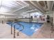 Indoor pool with clear blue water, easy access ladders, and a well-maintained pool area at 114 W Adams St # 907, Phoenix, AZ 85003