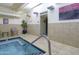Inviting spa area featuring tiled walls, a cozy hot tub, and a tropical potted plant at 114 W Adams St # 907, Phoenix, AZ 85003
