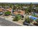 Aerial view of a home with a beautiful tile roof, pool, and landscaping at 12537 N 76Th Pl, Scottsdale, AZ 85260