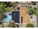 Aerial view of home's roof, solar panels and backyard oasis with a pool and mature landscaping at 12537 N 76Th Pl, Scottsdale, AZ 85260