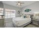 Comfortable bedroom boasts large window, plush carpet, and elegant decor at 12537 N 76Th Pl, Scottsdale, AZ 85260