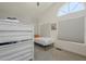 Bright bedroom with bunk beds and a arched window at 12537 N 76Th Pl, Scottsdale, AZ 85260