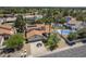 Inviting home with a two-car garage, desert landscaping, a tile roof and solar panels at 12537 N 76Th Pl, Scottsdale, AZ 85260