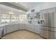 Updated kitchen with stainless steel appliances, modern cabinets, and open counter space at 12537 N 76Th Pl, Scottsdale, AZ 85260