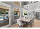 Eat-in kitchen with stainless appliances, stylish dining set and backyard access at 12537 N 76Th Pl, Scottsdale, AZ 85260