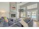Living area with fireplace, vaulted ceilings, TV, comfortable seating, and pool views at 12537 N 76Th Pl, Scottsdale, AZ 85260