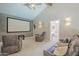 Inviting media room complete with a large projector screen and comfortable seating at 12537 N 76Th Pl, Scottsdale, AZ 85260