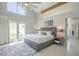 Bright main bedroom with vaulted ceilings, ceiling fan, access to the patio and a pool at 12537 N 76Th Pl, Scottsdale, AZ 85260