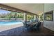 Outdoor dining area featuring covered patio, pavers, and beautiful views of the backyard pool area at 12537 N 76Th Pl, Scottsdale, AZ 85260