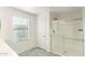 Well-lit bathroom featuring tiled floors, a glass-enclosed shower and bright natural light at 1255 N Banning --, Mesa, AZ 85205