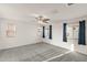 Spacious bedroom with neutral carpeting and white walls is illuminated by natural light from three windows at 1255 N Banning --, Mesa, AZ 85205