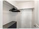 Closet featuring dark wood drawers and a shelf with hanging clothes at 1255 N Banning --, Mesa, AZ 85205