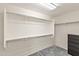 Walk-in closet with ample shelving and hanging space, plus a chest of drawers on neutral carpet at 1255 N Banning --, Mesa, AZ 85205