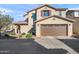 Inviting two-story home featuring an attached two-car garage and well-maintained landscaping at 1255 N Banning --, Mesa, AZ 85205