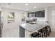 Stylish kitchen features granite counters, stainless appliances, and a breakfast bar with seating at 1255 N Banning --, Mesa, AZ 85205