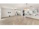 Expansive living area with new flooring, a ceiling fan, and an open layout to the kitchen at 1255 N Banning --, Mesa, AZ 85205