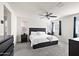 Spacious main bedroom with ample natural light, ceiling fan, and stylish dark wood furnishings at 1255 N Banning --, Mesa, AZ 85205