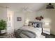 Serene bedroom featuring a comfortable bed, ceiling fan, and ensuite bathroom at 14300 W Bell Rd # 261, Surprise, AZ 85374