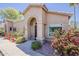 Charming single-story home featuring an arched entryway and well-maintained landscaping at 14300 W Bell Rd # 261, Surprise, AZ 85374