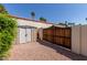 Gated backyard area with storage shed and desert landscaping at 14828 N Skokie Ct, Phoenix, AZ 85022