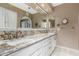 Bathroom with a granite countertop and dual sinks at 14828 N Skokie Ct, Phoenix, AZ 85022