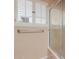 Close up of glass enclosed shower and shuttered window in bathroom at 14828 N Skokie Ct, Phoenix, AZ 85022