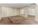 Spacious bedroom with a large mirror and neutral carpet at 14828 N Skokie Ct, Phoenix, AZ 85022