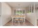 Bright dining room with natural light and decorative chandelier at 14828 N Skokie Ct, Phoenix, AZ 85022