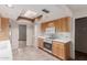 Bright kitchen with modern appliances, skylight, and tile flooring at 14828 N Skokie Ct, Phoenix, AZ 85022