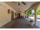 Covered patio with ceiling fans and views of backyard and pool at 14828 N Skokie Ct, Phoenix, AZ 85022