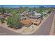 Tan home with mature trees, gravel landscaping, fenced backyard, and a shed at 1526 W Huntington Dr, Tempe, AZ 85282