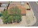 Aerial view showing mature landscaping, a front-facing garage, and low maintenance yard at 1526 W Huntington Dr, Tempe, AZ 85282