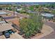 Tan home with mature trees, gravel landscaping, a fenced backyard with a shed at 1526 W Huntington Dr, Tempe, AZ 85282