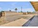 Large backyard with block fence, shed, and a view of a palm tree at 1526 W Huntington Dr, Tempe, AZ 85282