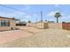 Spacious backyard with gravel landscaping, shed, brick patio, and block wall fencing at 1526 W Huntington Dr, Tempe, AZ 85282
