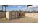 Fenced-in backyard featuring a storage shed, gravel area, and a secure, private outdoor space at 1526 W Huntington Dr, Tempe, AZ 85282