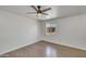 Bedroom with laminated wood flooring, ceiling fan and a window that lets in plenty of sunlight at 1526 W Huntington Dr, Tempe, AZ 85282
