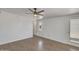 A bedroom features laminated wood flooring, ceiling fan, and access to exterior at 1526 W Huntington Dr, Tempe, AZ 85282