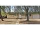 Charming single-story home featuring a well-maintained gravel yard, stone pathway, and mature tree at 1526 W Huntington Dr, Tempe, AZ 85282