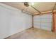 Garage with concrete floors and an automatic overhead door at 1526 W Huntington Dr, Tempe, AZ 85282