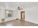 Bright living area with a ceiling fan, window and laminated wood flooring at 1526 W Huntington Dr, Tempe, AZ 85282