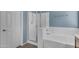 Bathroom featuring both a walk-in shower and tub at 15564 W Mescal St, Surprise, AZ 85379