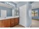Bathroom with double sinks, updated vanity, and a large mirror at 15564 W Mescal St, Surprise, AZ 85379