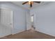 Neutral bedroom with doorway to another room, offering versatility and multiple access points at 15564 W Mescal St, Surprise, AZ 85379