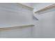 Walk-in closet features built-in shelving and rods, providing ample and organized storage space at 15564 W Mescal St, Surprise, AZ 85379