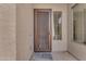 Home entryway featuring a secure screen door and a view of a window to the left at 15564 W Mescal St, Surprise, AZ 85379