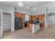 Bright kitchen featuring wood cabinets, tile floors, and a center island at 15564 W Mescal St, Surprise, AZ 85379
