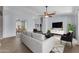 Bright, open-concept living area with comfortable sofa and modern furnishings at 15564 W Mescal St, Surprise, AZ 85379